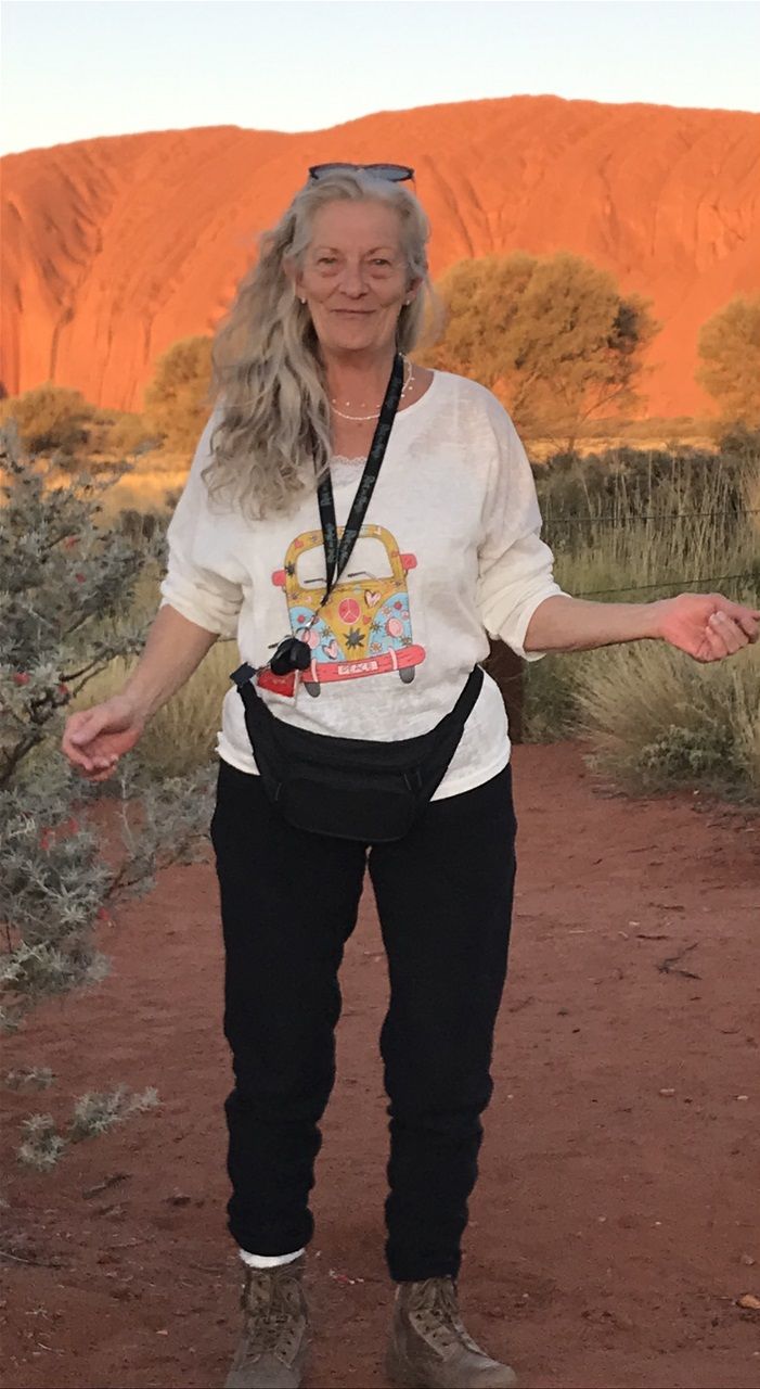 Peta Anderson (medium) at the Uluru Field of Lights Festival in Alice Springs Australia June 2022. The Uluru rock formation has been a sacred site for the aboriginal peoples of Australia for sixty thousand years.